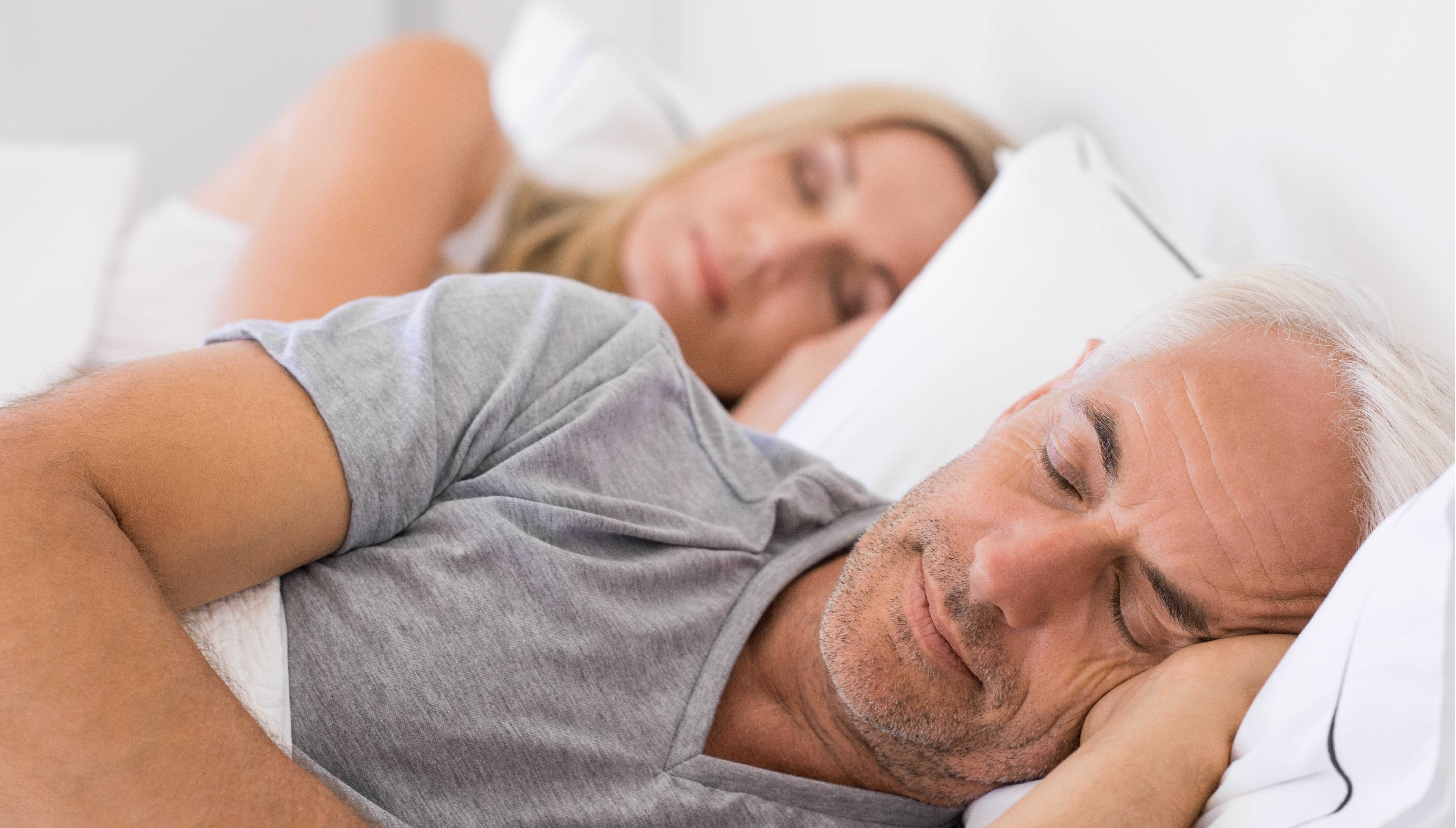 man sleeping badly